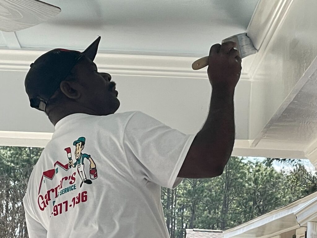 Dedicated team of Fayetteville, North Carolina painters transforming a home exterior.