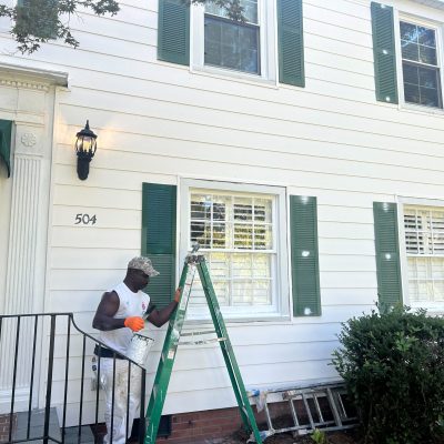 Dedicated team of Fayetteville, North Carolina painters transforming a home exterior.